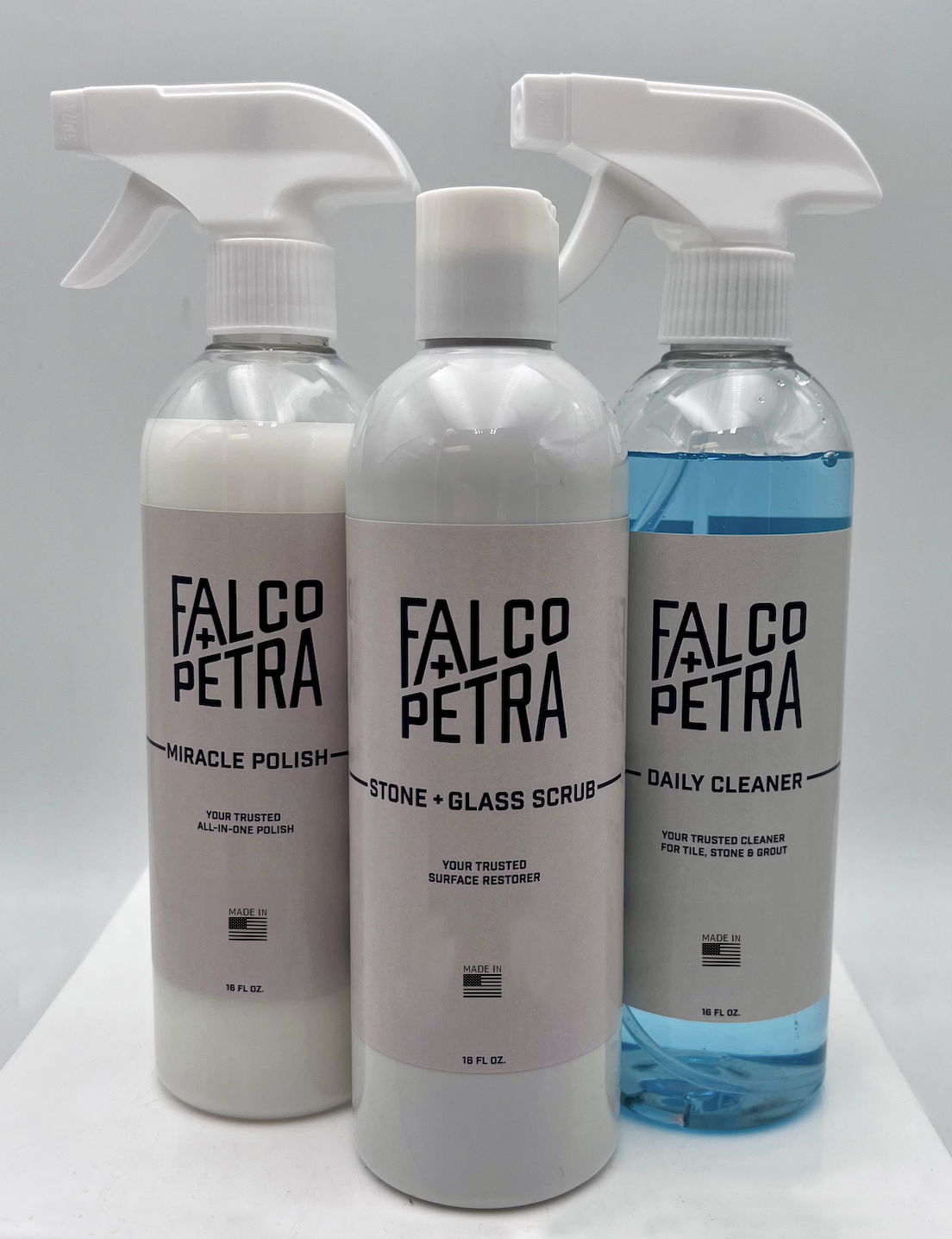 Three bottles of Falco Petra cleaning products on a white background