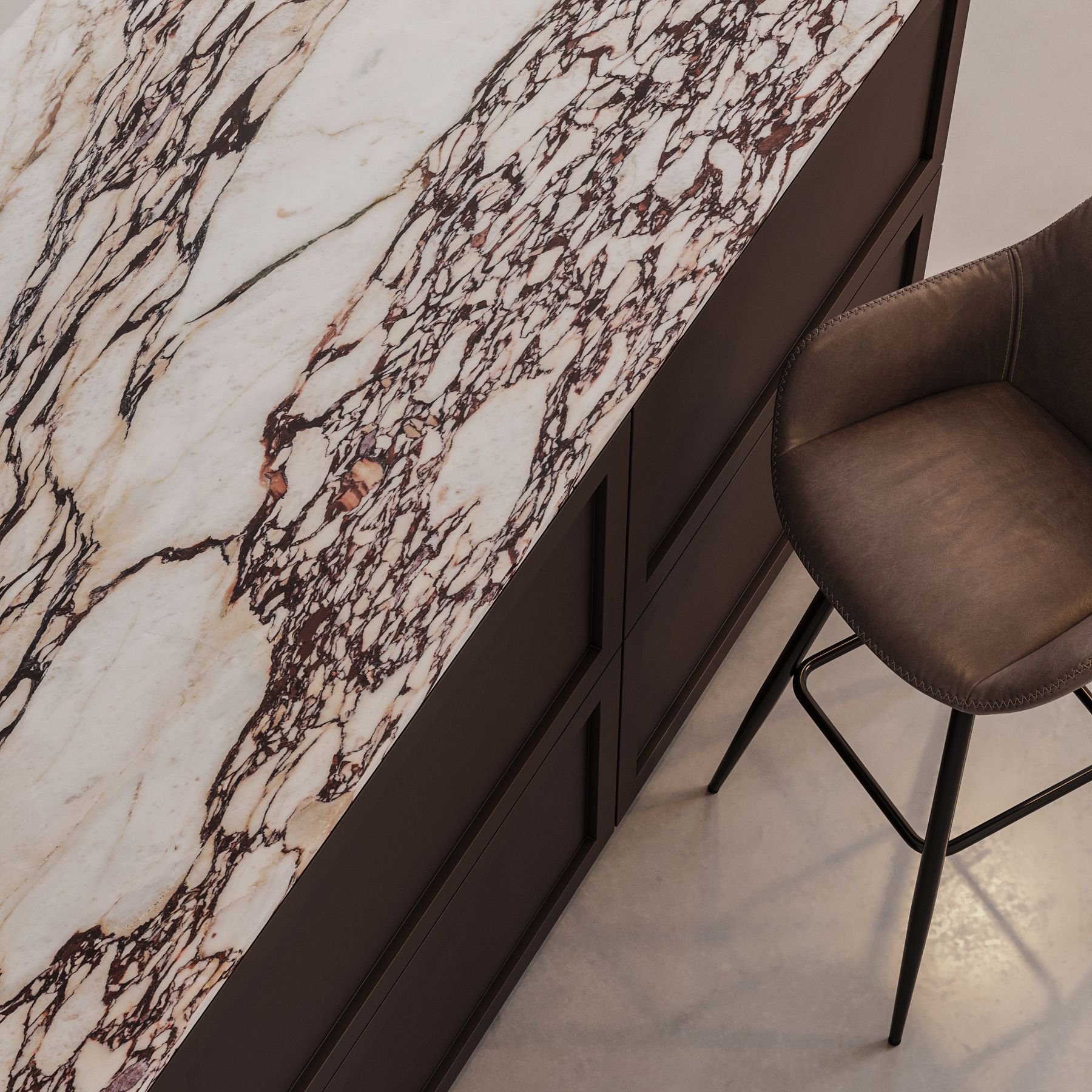 Marble countertop with dark wood cabinets and a brown leather stool.