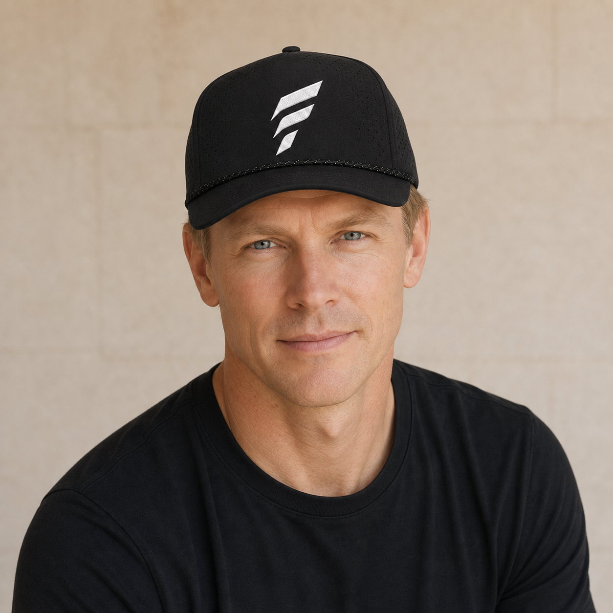 Man wearing the black Falco + Petra Torch performance snapback