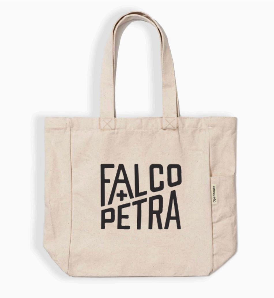Beige tote bag with 'Falco Petra' text on a white background